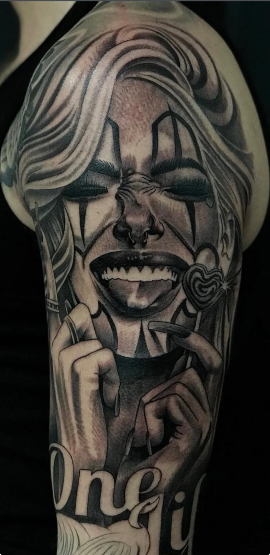 Black & grey clown portrait tattoo by Danny Birch at Mantra 2