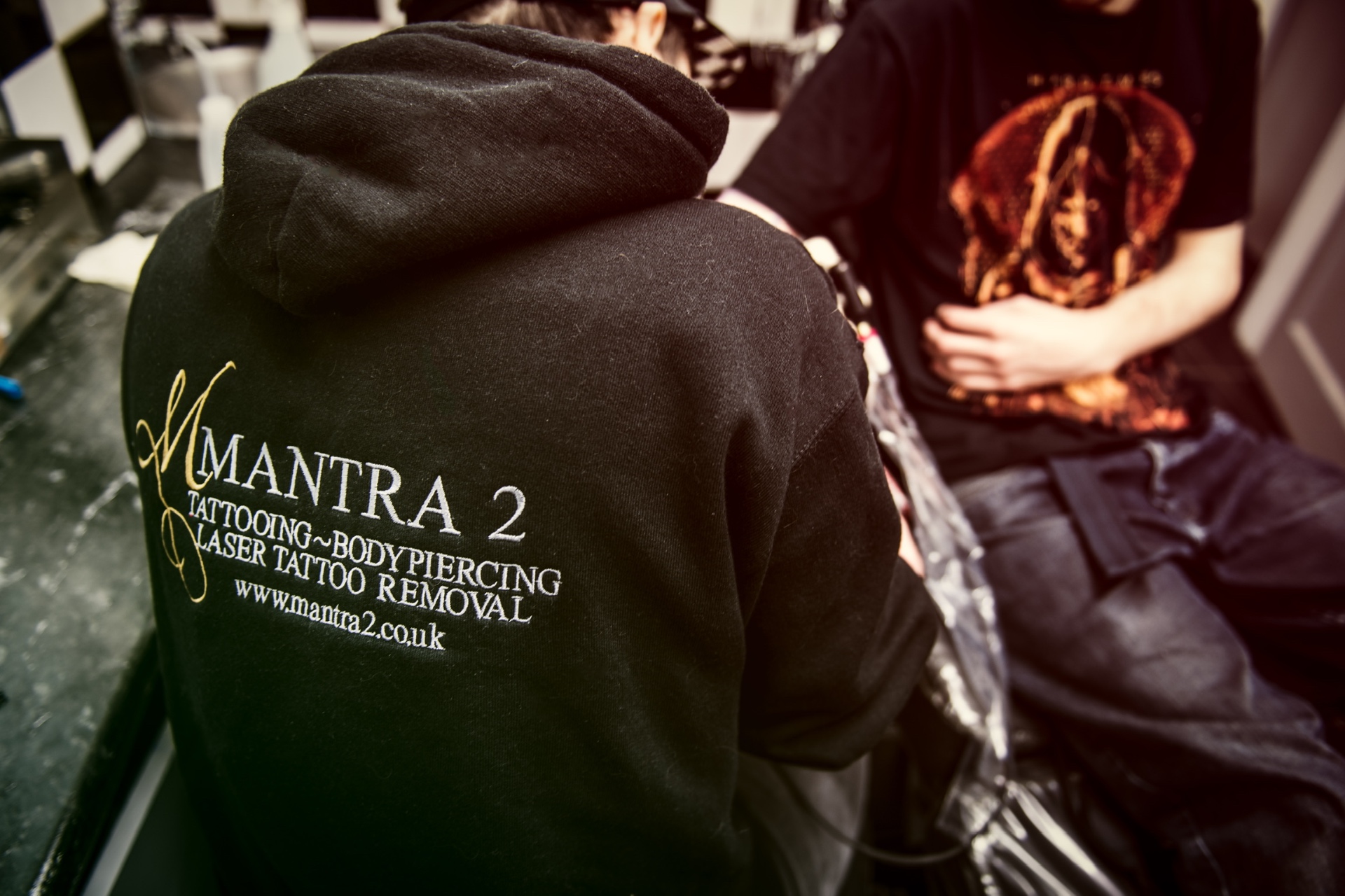 Mantra 2 artist at work wearing studio-branded clothing